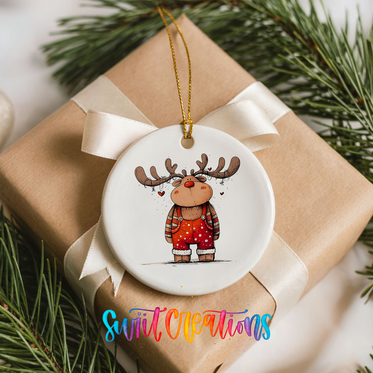 Reindeer in Red Sweater and Black Boots Christmas ornament placed on a wrapped Christmas gift