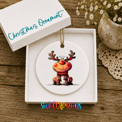Jolly Reindeer in Red and Black Outfit Christmas ornament displayed in an included gift box