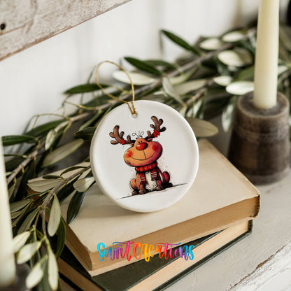 Jolly Reindeer in Red and Black Outfit Christmas ornament styled on books with holiday greenery