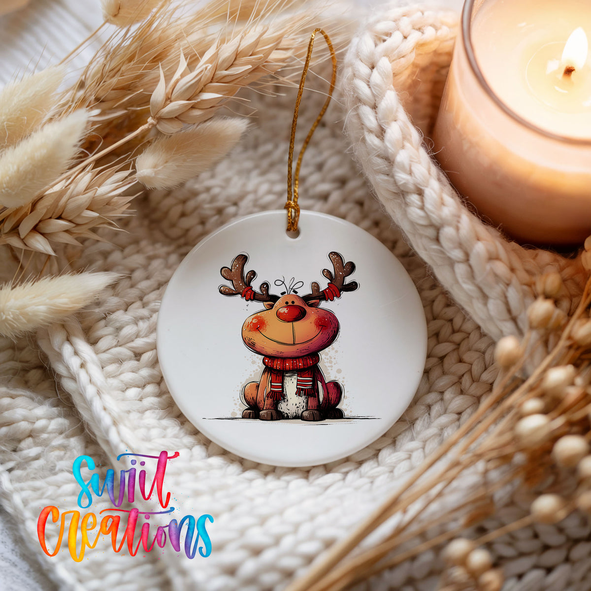 Jolly Reindeer in Red and Black Outfit Christmas ornament styled beside a candle and cozy knit blanket