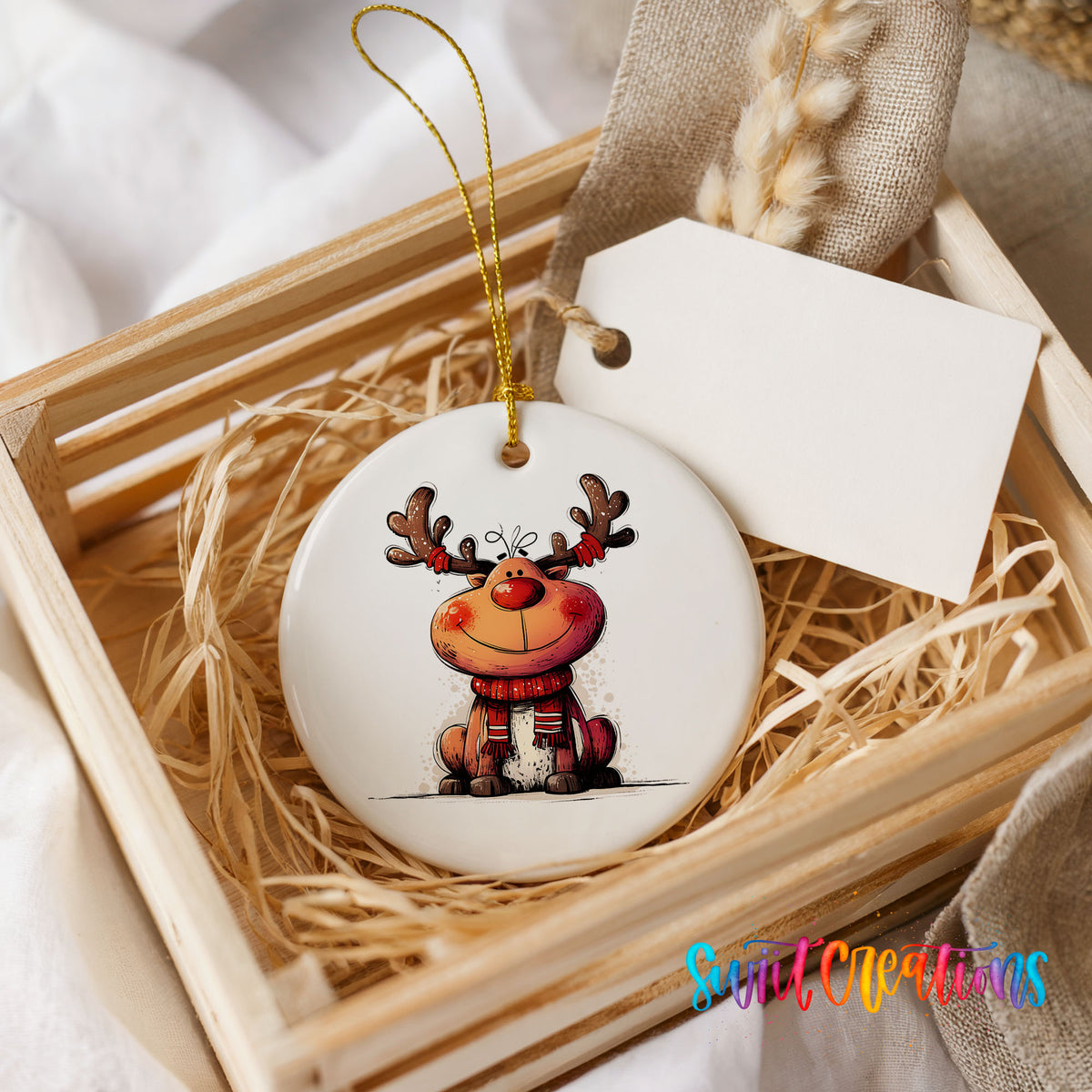Jolly Reindeer in Red and Black Outfit Christmas ornament presented in a rustic wooden gift crate