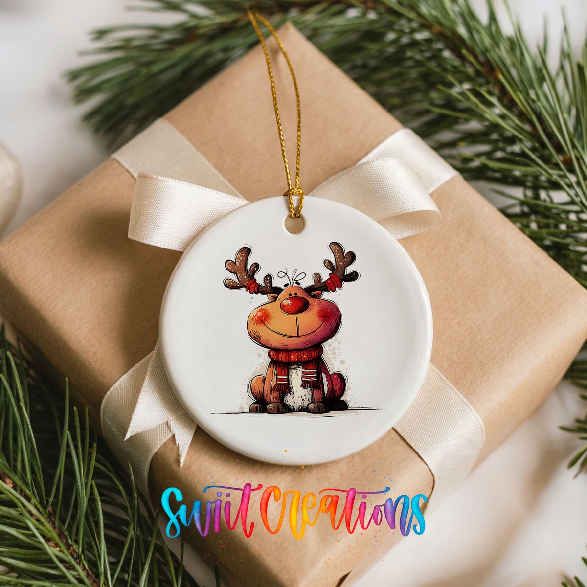 Jolly Reindeer in Red and Black Outfit Christmas ornament placed on a wrapped Christmas gift