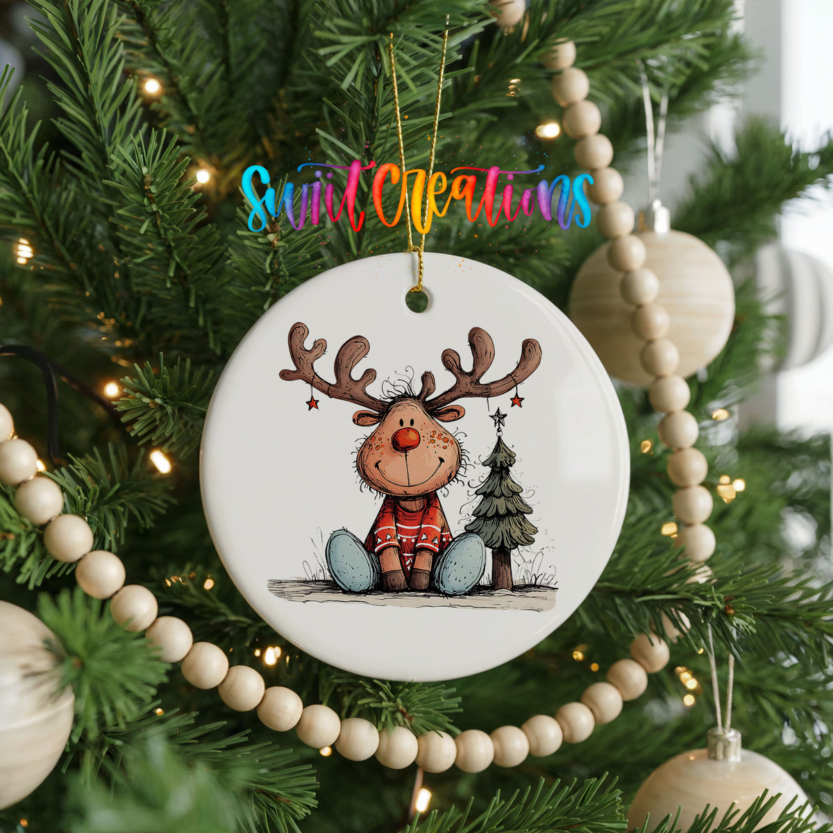 Sitting Reindeer with Gift and Christmas Tree Christmas ornament hanging on a decorated Christmas tree