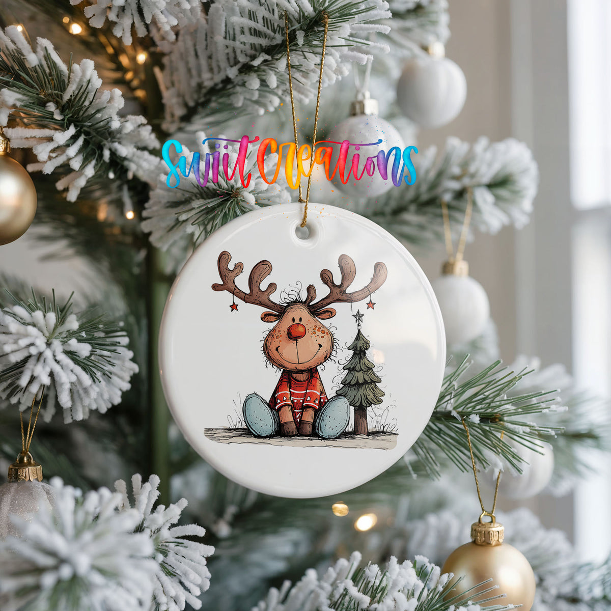 Sitting Reindeer with Gift and Christmas Tree Christmas ornament hanging on a frosted Christmas tree