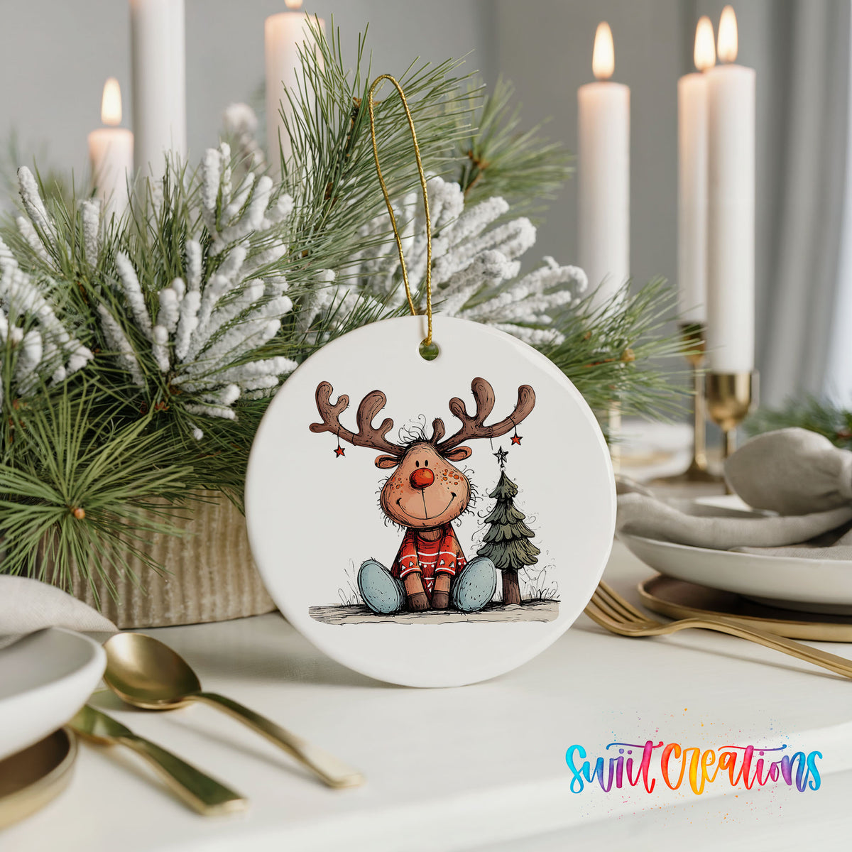 Sitting Reindeer with Gift and Christmas Tree Christmas ornament styled with elegant holiday table decor