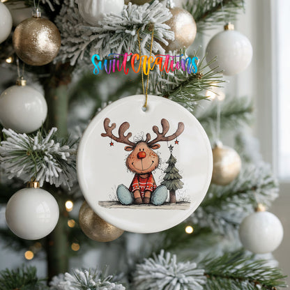 Sitting Reindeer with Gift and Christmas Tree Christmas ornament hanging on a frosted holiday tree
