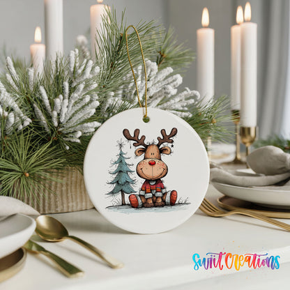 Sitting Reindeer with Pine Trees and Gift Christmas ornament styled with elegant holiday table decor