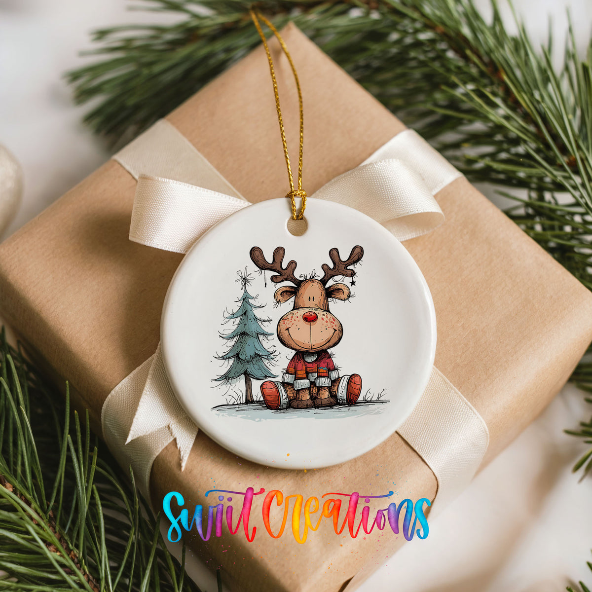 Sitting Reindeer with Pine Trees and Gift Christmas ornament placed on a wrapped Christmas gift