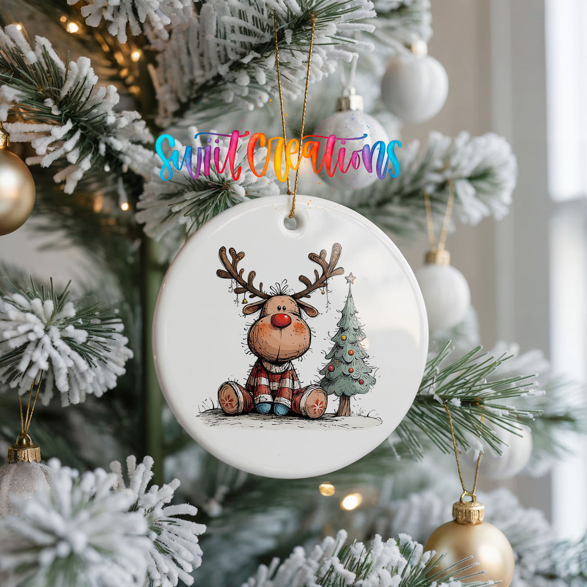 Sitting Reindeer Beside Christmas Tree Christmas ornament hanging on a frosted Christmas tree