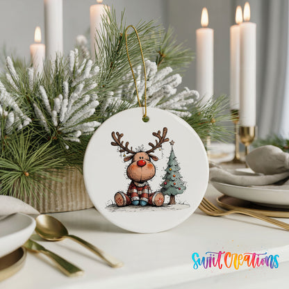 Sitting Reindeer Beside Christmas Tree Christmas ornament styled with elegant holiday table decor