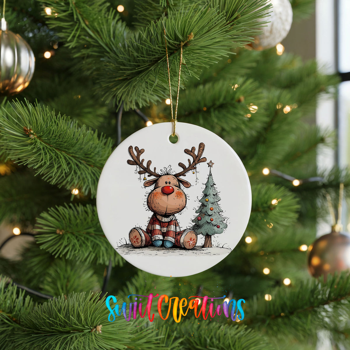Sitting Reindeer Beside Christmas Tree Christmas ornament hanging on a green Christmas tree