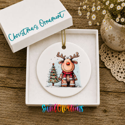 Reindeer in Red Scarf with Pine Trees Christmas ornament displayed in an included gift box