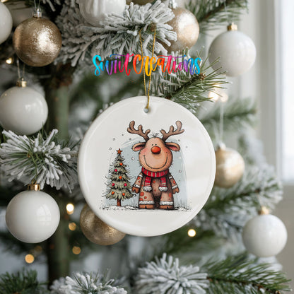Reindeer in Red Scarf with Pine Trees Christmas ornament hanging on a frosted holiday tree