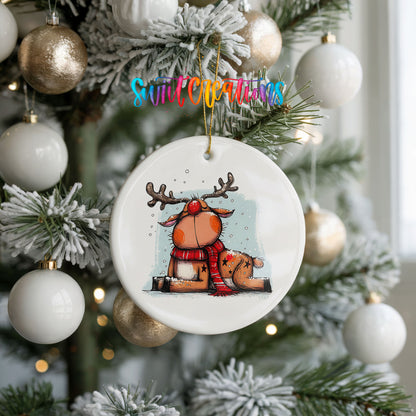 Santa and Reindeer with Gift Sack Christmas ornament hanging on a frosted holiday tree