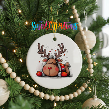 Cute Reindeer with Red Gift Bag Christmas ornament hanging on a decorated Christmas tree