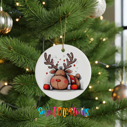 Cute Reindeer with Red Gift Bag Christmas ornament hanging on a green Christmas tree