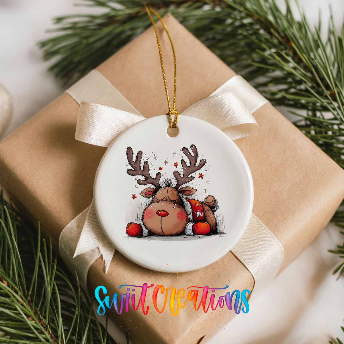Cute Reindeer with Red Gift Bag Christmas ornament placed on a wrapped Christmas gift