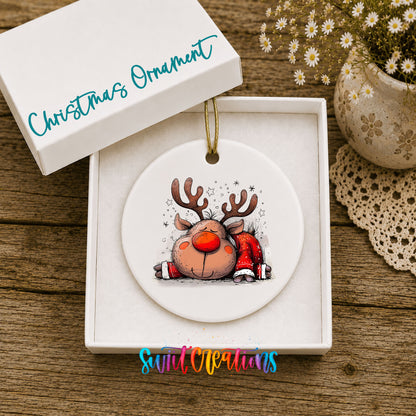 Sleeping Reindeer in Red Scarf Christmas ornament displayed in an included gift box