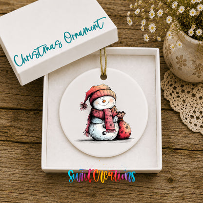 Snowman in Red Scarf with Gift Christmas ornament displayed in an included gift box