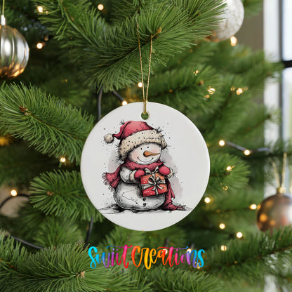 Snowman Holding a Christmas Heart Christmas ornament hanging on a green Christmas tree
