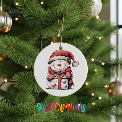 Snowman with Wrapped Christmas Gift Christmas ornament hanging on a green Christmas tree