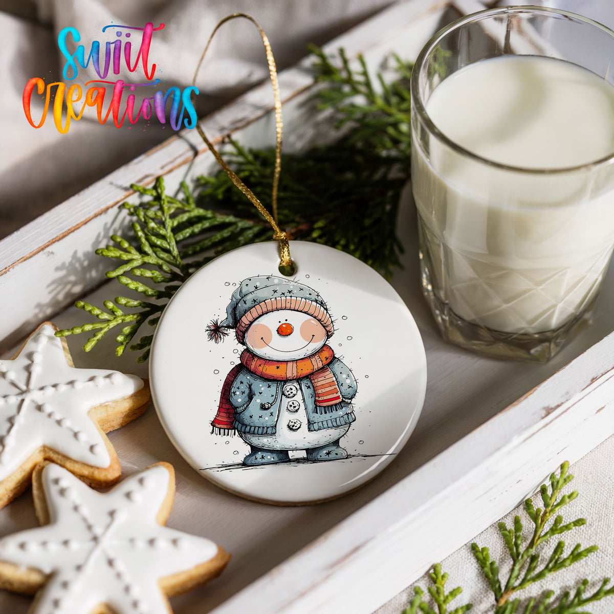 Smiling Snowman in Blue Winter Hat Christmas ornament styled with cookies and milk