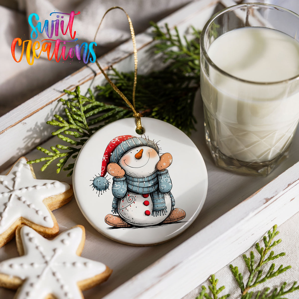 Snowman in Blue Hat and Scarf Christmas ornament styled with cookies and milk