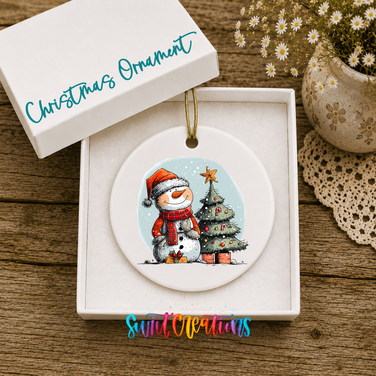 Snowman Beside a Christmas Tree Christmas ornament displayed in an included gift box