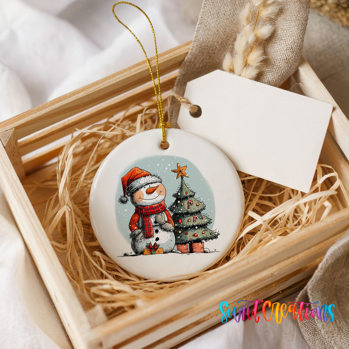 Snowman Beside a Christmas Tree Christmas ornament presented in a rustic wooden gift crate