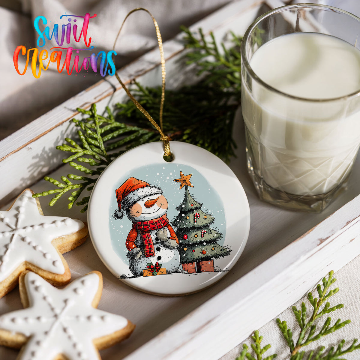 Snowman Beside a Christmas Tree Christmas ornament styled with cookies and milk