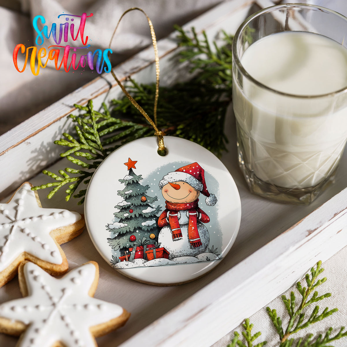 Santa Decorating a Christmas Tree Christmas ornament styled with cookies and milk