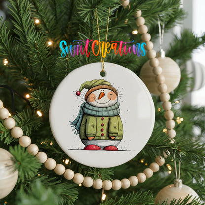 Snowman in Green Winter Coat Christmas ornament hanging on a decorated Christmas tree