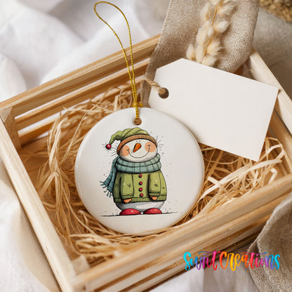 Snowman in Green Winter Coat Christmas ornament presented in a rustic wooden gift crate