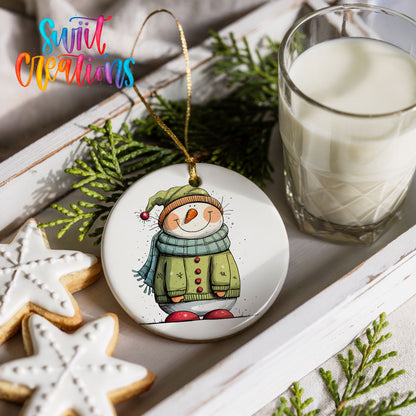 Snowman in Green Winter Coat Christmas ornament styled with cookies and milk