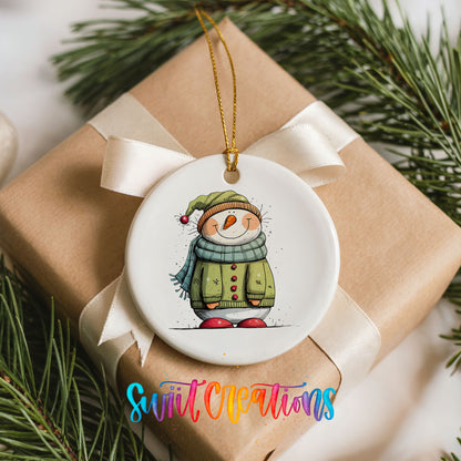 Snowman in Green Winter Coat Christmas ornament placed on a wrapped Christmas gift