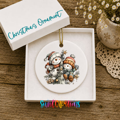 Snowman Family Winter ceramic Christmas ornament displayed in gift box