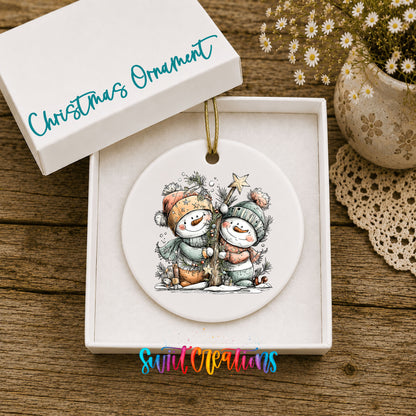 Snowman Couple with Holiday Stars ceramic Christmas ornament displayed in gift box