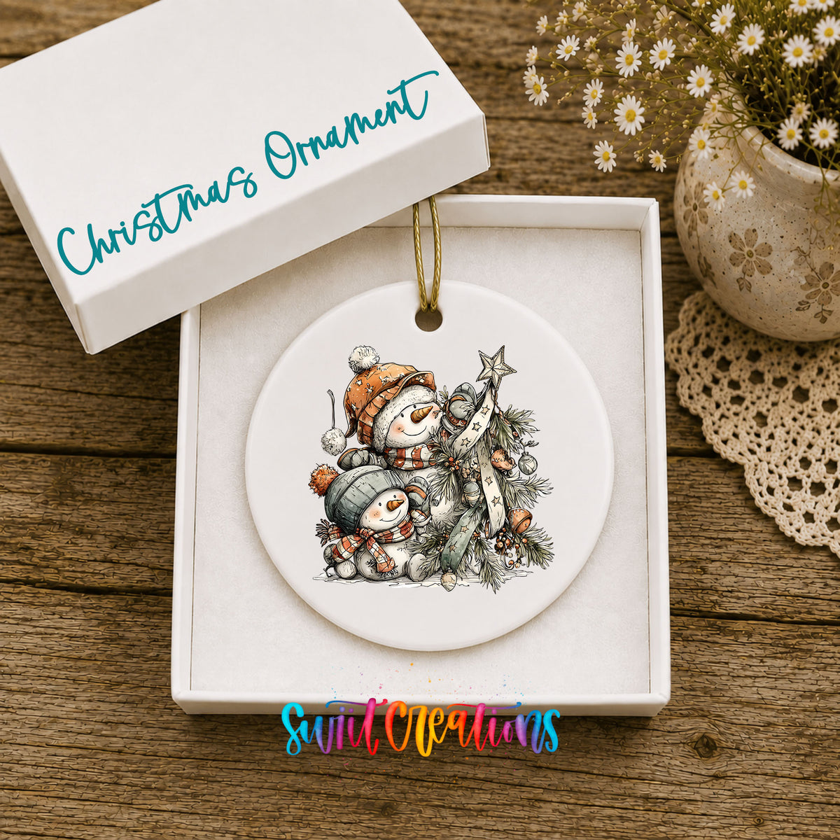 Snowman Family with Evergreen Tree ceramic Christmas ornament displayed in gift box