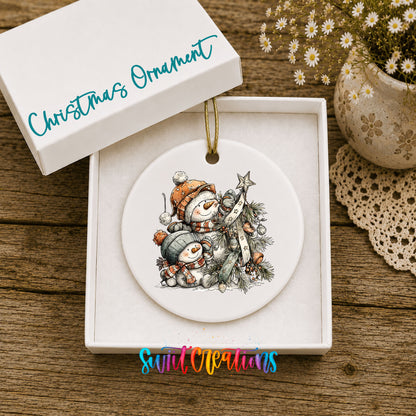 Snowman Family with Evergreen Tree ceramic Christmas ornament displayed in gift box