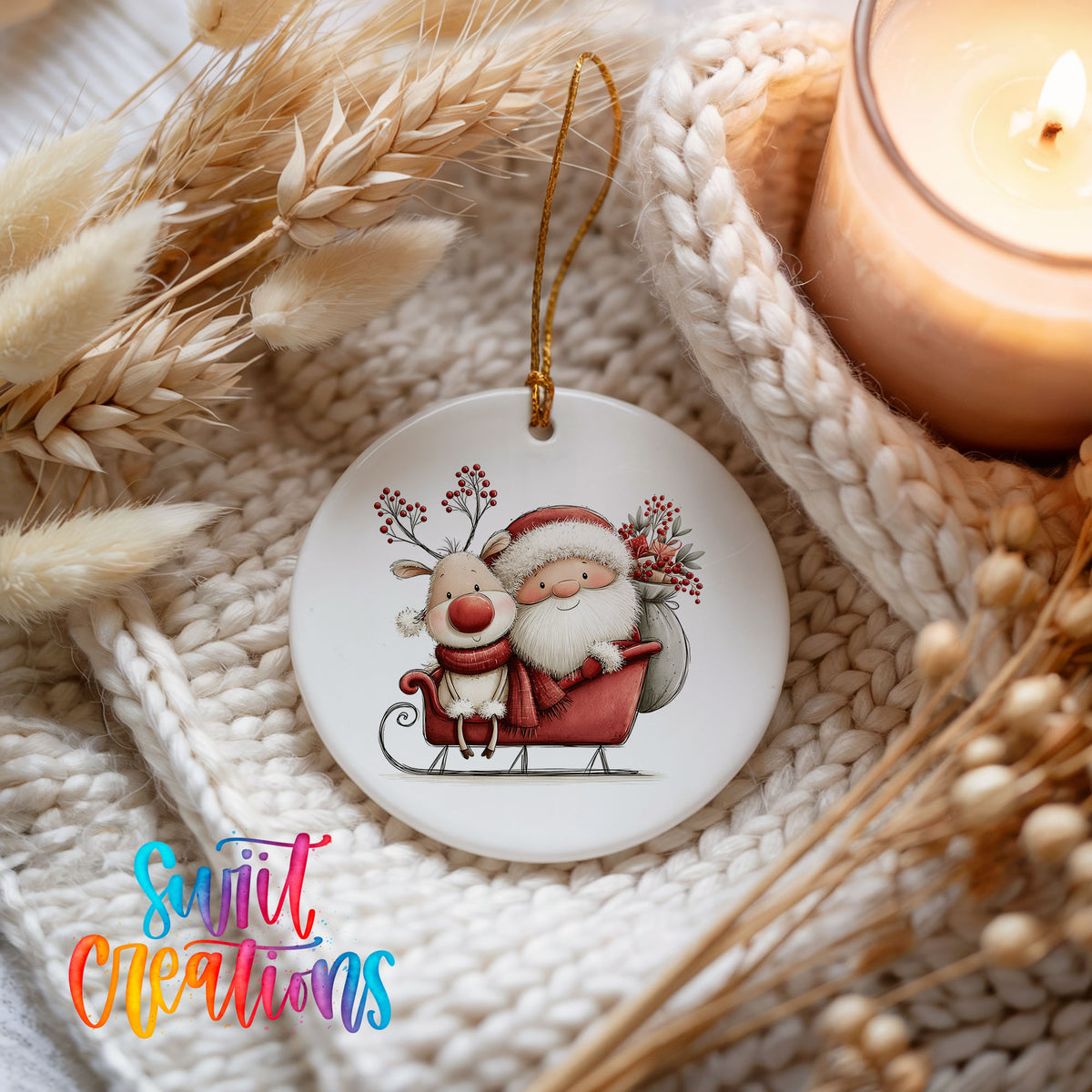 Santa Claus riding in a sleigh with a reindeer ceramic Christmas ornament styled on a cozy knit blanket
