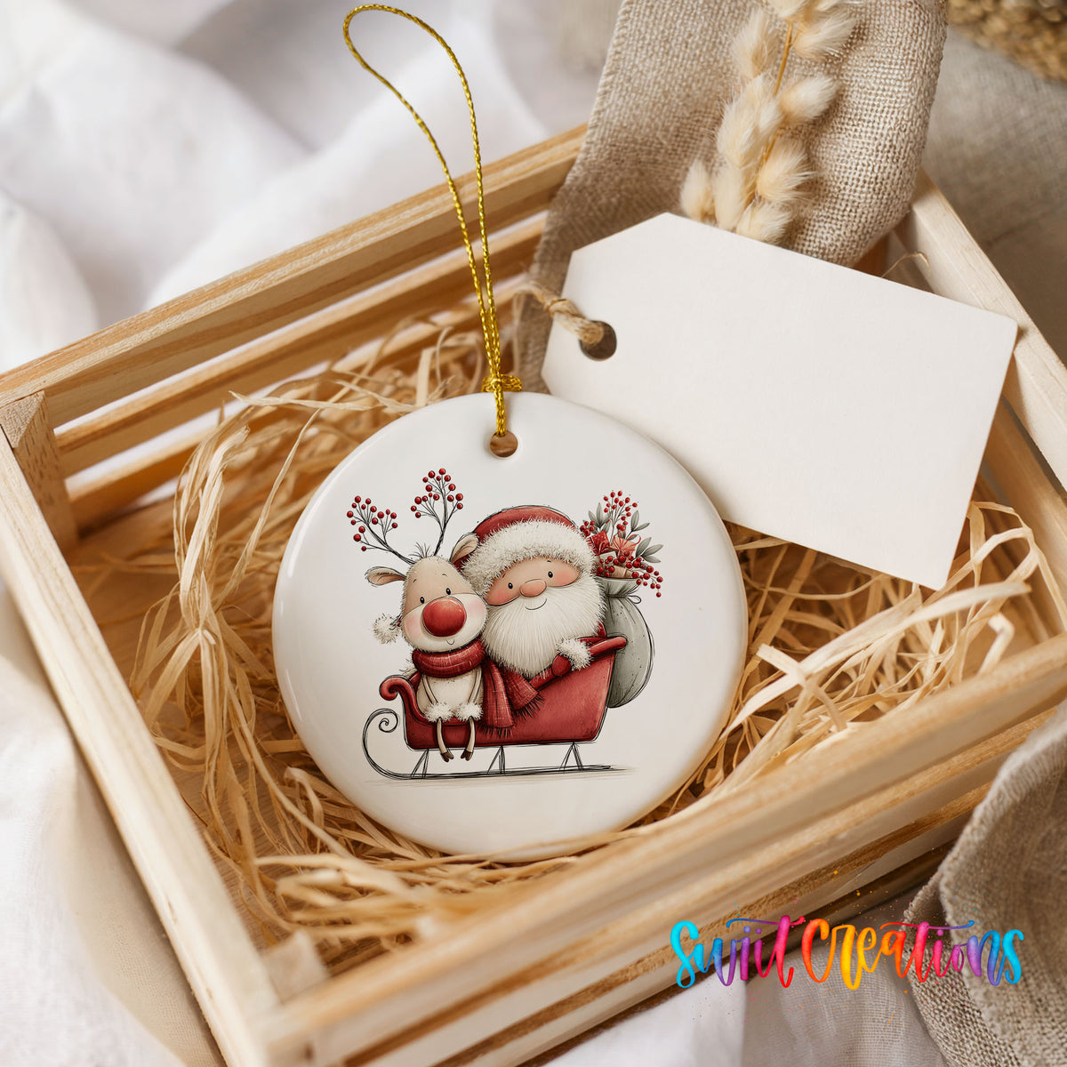 Santa Claus riding in a sleigh with a reindeer ceramic Christmas ornament displayed in a wooden gift crate