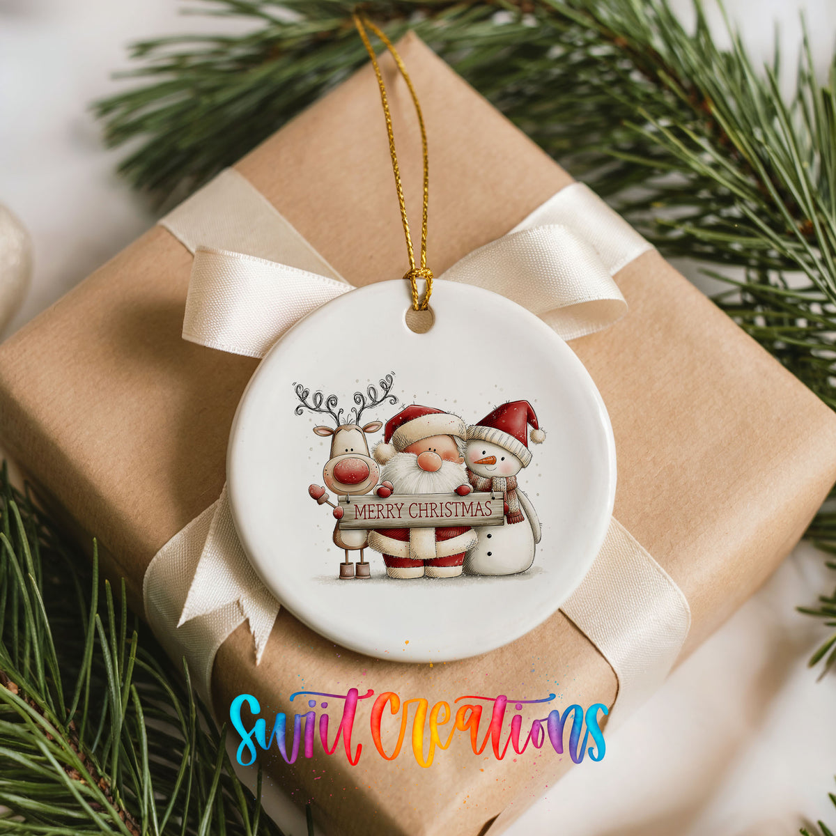 Santa Claus with a reindeer and snowman holding a Merry Christmas sign ceramic Christmas ornament displayed on a wrapped Christmas gift