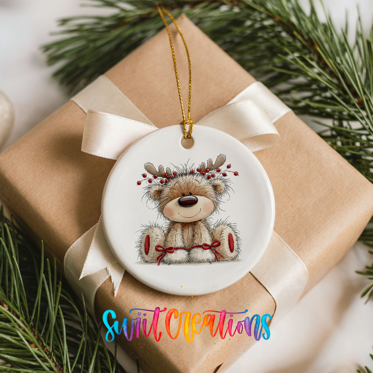 teddy bear wearing reindeer antlers with red winter skis ceramic Christmas ornament displayed on a wrapped Christmas gift