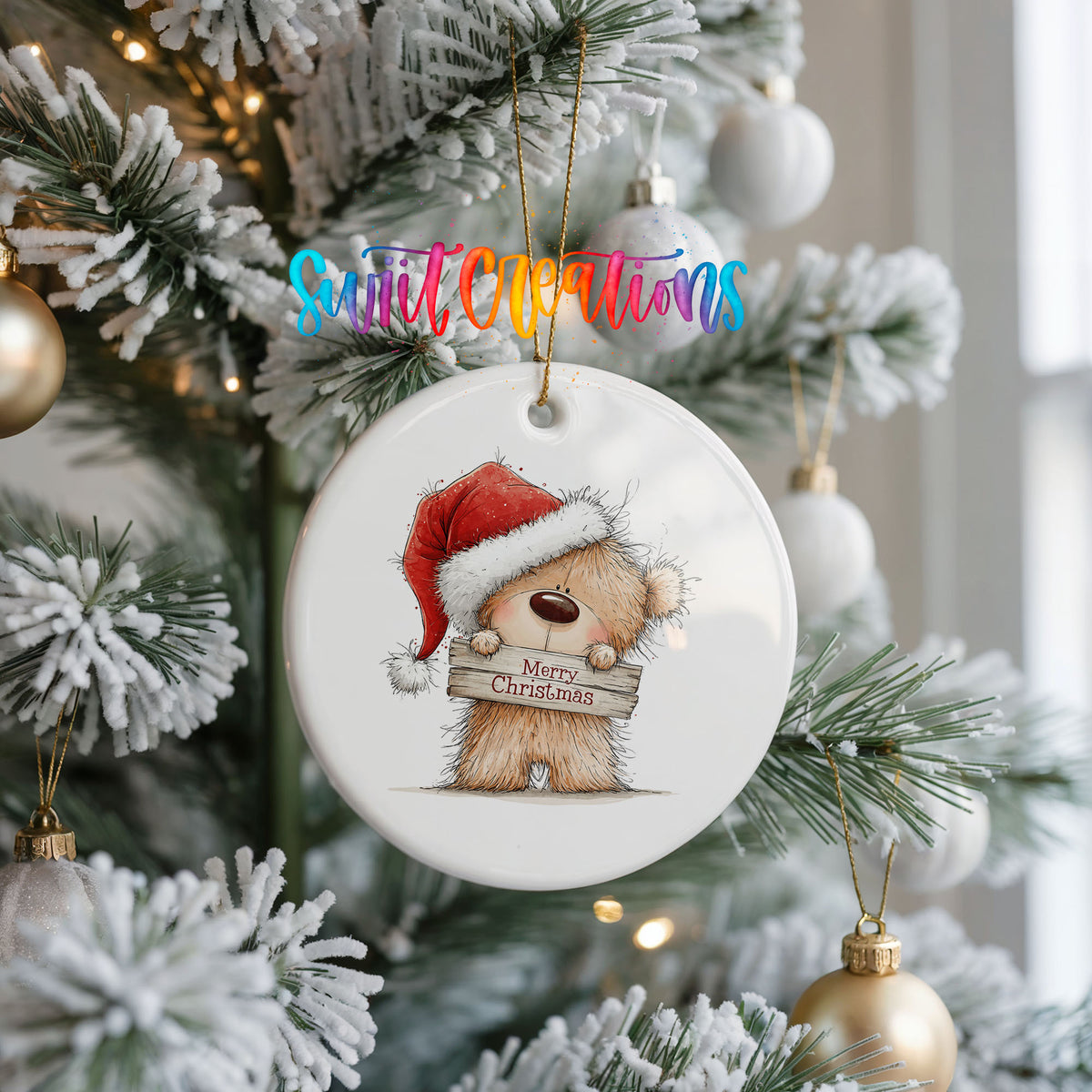 teddy bear in a Santa hat holding a Merry Christmas sign ceramic Christmas ornament hanging on a frosted Christmas tree
