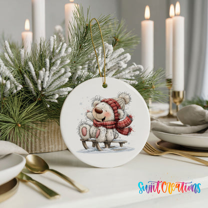 polar bear in a red winter scarf playing in the snow ceramic Christmas ornament shown in a holiday table setting
