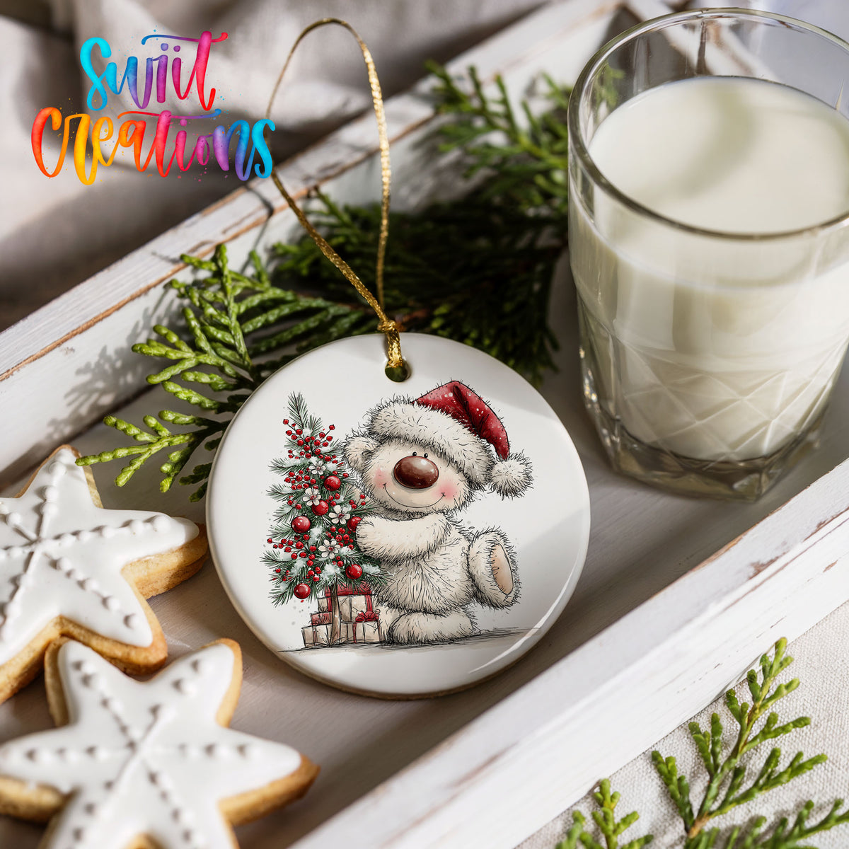 polar bear beside a decorated Christmas tree and gifts ceramic Christmas ornament styled with holiday cookies and a candle