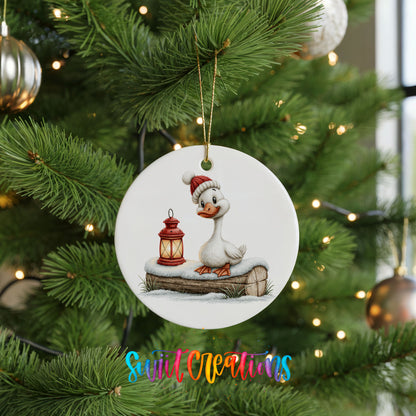 Christmas goose standing beside a red lantern ceramic Christmas ornament hanging on a lit Christmas tree