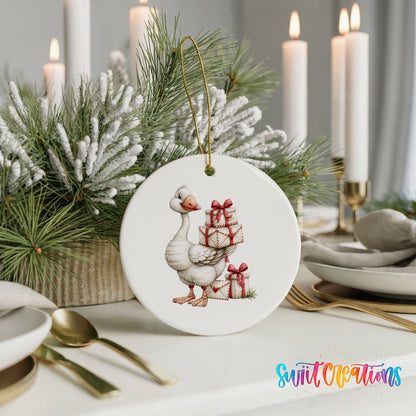Christmas goose carrying a stack of wrapped gifts ceramic Christmas ornament shown in a holiday table setting