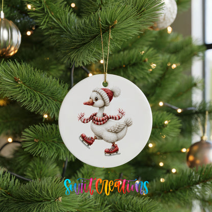 ice skating Christmas goose in a striped scarf ceramic Christmas ornament hanging on a lit Christmas tree