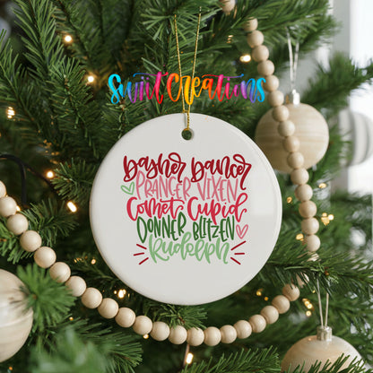 Colorful reindeer names typography ceramic Christmas ornament hanging on a decorated Christmas tree
